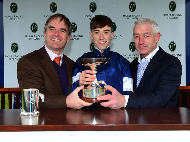 2018 Champion Apprentice Jockey, Shane Crosse, with his dad Pat and John Osborne, CEO of HRI Racecourses Ltd
